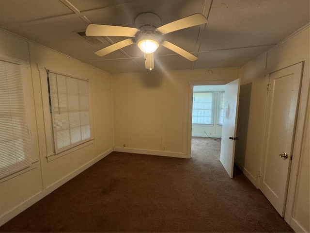 carpeted empty room with ceiling fan