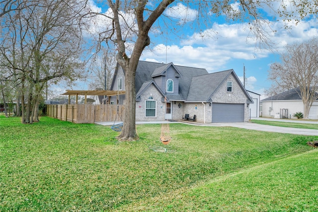 view of front of home with a garage and a front yard