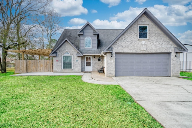 view of front of property featuring a garage and a front yard