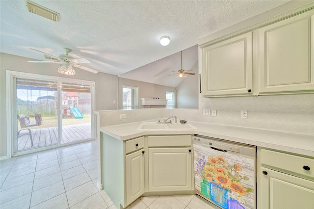 kitchen with lofted ceiling, sink, ceiling fan, white dishwasher, and light tile patterned flooring