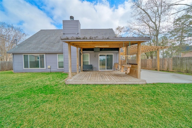 back of house with a yard, a deck, and a patio area