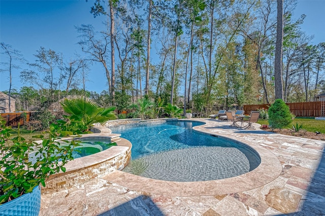 view of swimming pool featuring an in ground hot tub and a patio area