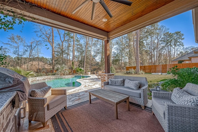 view of patio / terrace featuring an outdoor living space, a fenced in pool, and ceiling fan