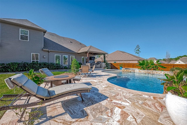 view of swimming pool featuring a patio area