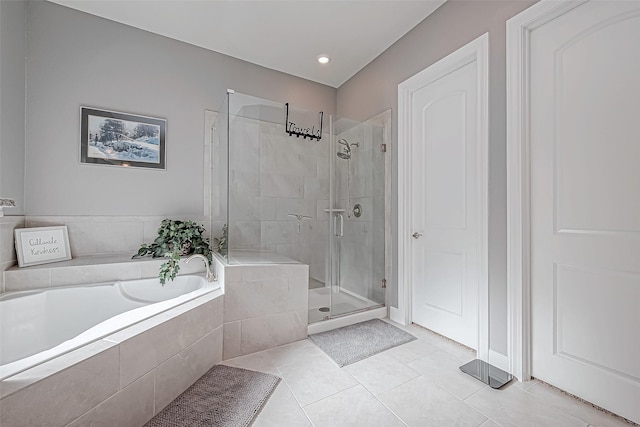 bathroom featuring tile patterned floors and plus walk in shower