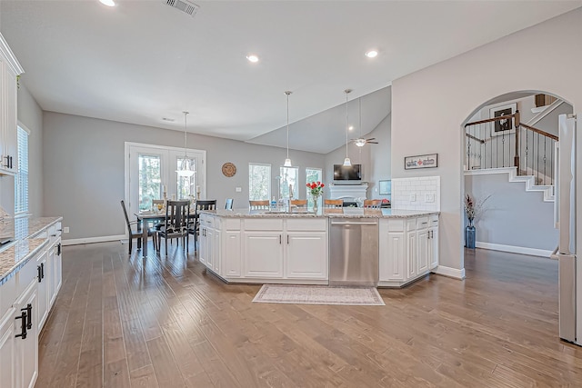 kitchen with white cabinetry, dishwasher, and hanging light fixtures