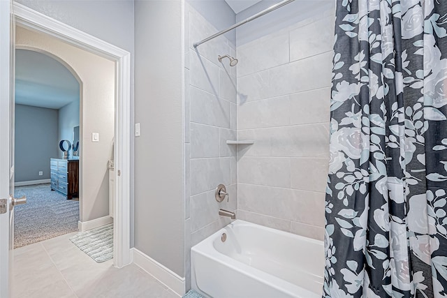 bathroom featuring tile patterned flooring and shower / bath combo with shower curtain