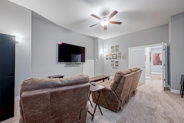 carpeted living room featuring ceiling fan