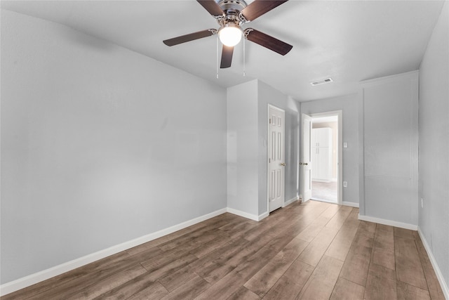 spare room featuring ceiling fan and wood-type flooring