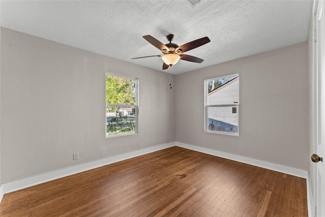 spare room featuring ceiling fan and hardwood / wood-style flooring