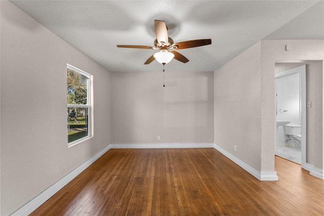 unfurnished room with hardwood / wood-style floors and ceiling fan