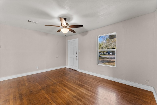 empty room featuring ceiling fan and hardwood / wood-style flooring