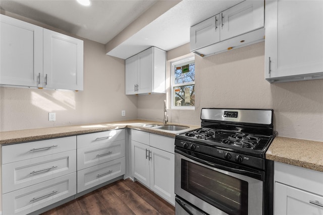 kitchen with white cabinetry, sink, and stainless steel range with gas stovetop