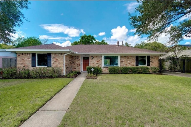 single story home featuring a front lawn