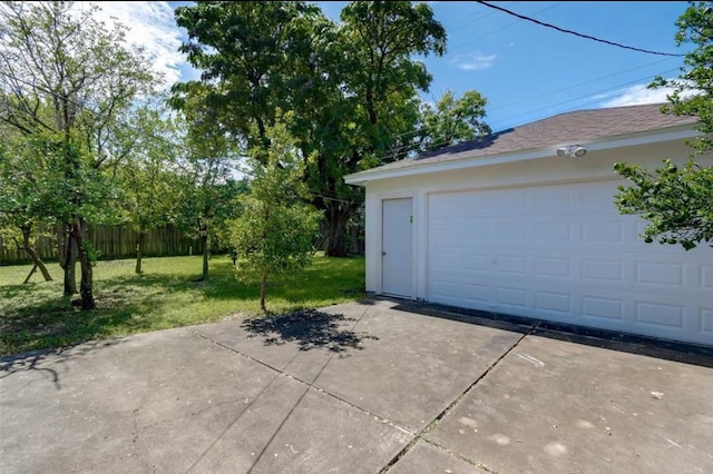 garage with a yard