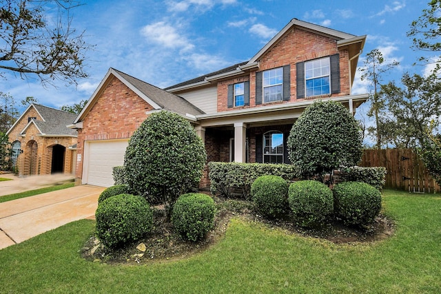 craftsman-style home featuring a garage and a front yard