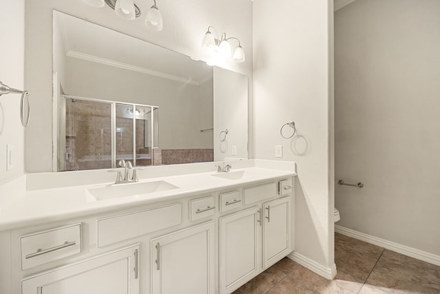 bathroom with tile patterned flooring, crown molding, tiled shower, toilet, and vanity