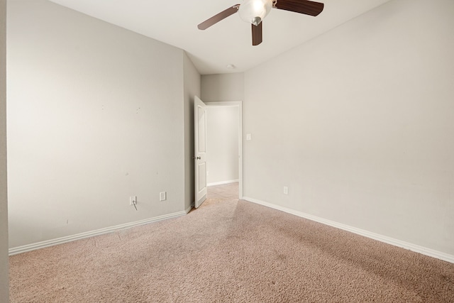 spare room with light carpet and ceiling fan