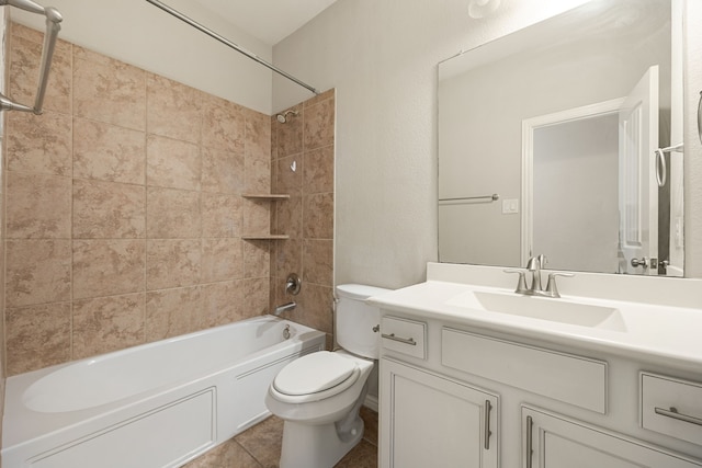 full bathroom featuring tile patterned flooring, tiled shower / bath combo, toilet, and vanity