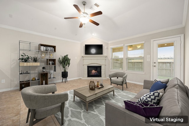 tiled living room featuring ceiling fan, vaulted ceiling, and ornamental molding