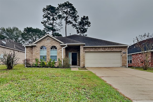 ranch-style home with a garage and a front yard