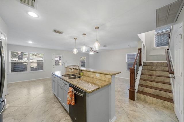 kitchen with sink, a center island with sink, dishwasher, gray cabinets, and hanging light fixtures