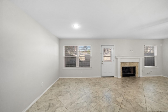 unfurnished living room with a fireplace