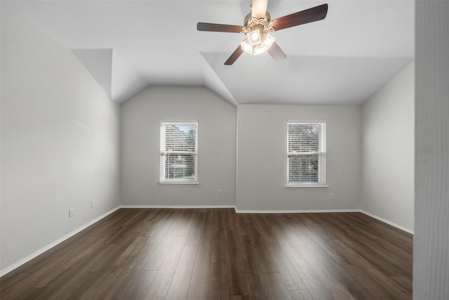 bonus room featuring ceiling fan, dark wood-type flooring, and lofted ceiling