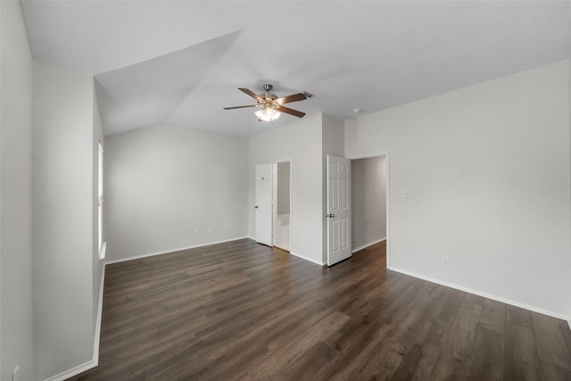 spare room with ceiling fan, dark hardwood / wood-style floors, and lofted ceiling