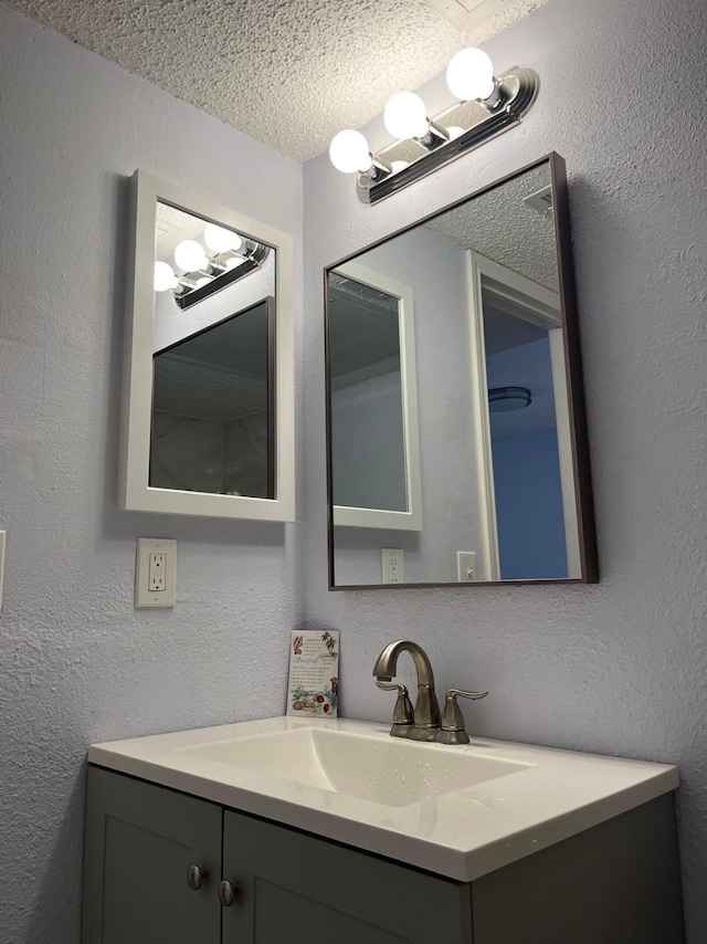 bathroom featuring vanity and a textured ceiling