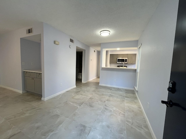 interior space featuring a textured ceiling