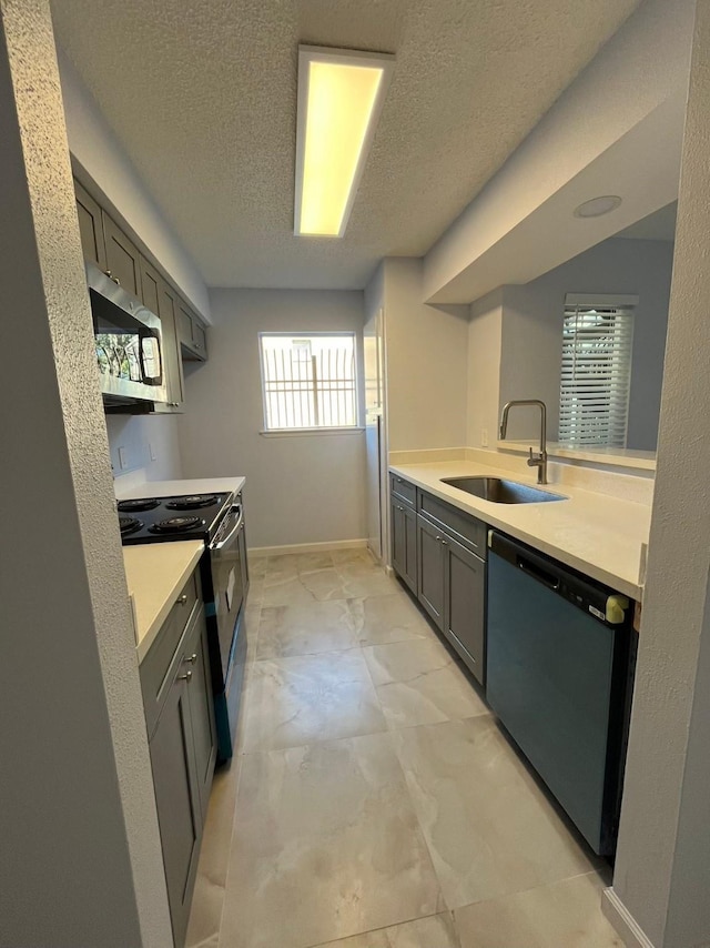 kitchen featuring sink, stove, black dishwasher, and a textured ceiling