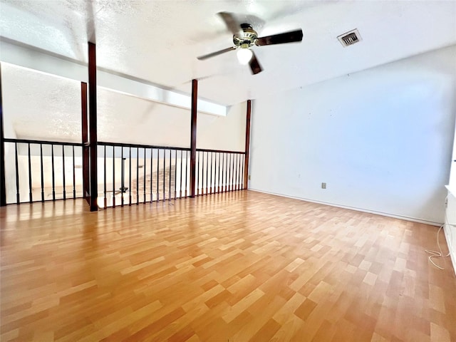 spare room with light hardwood / wood-style floors and ceiling fan