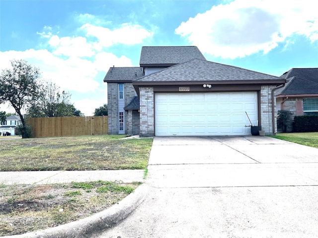 view of front facade with a front yard and a garage