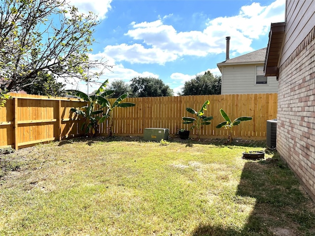 view of yard with central air condition unit