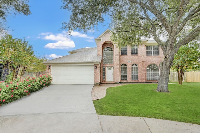 view of front facade featuring a front lawn and a garage