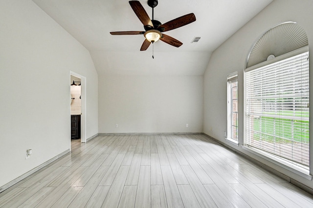 unfurnished living room with ceiling fan, light hardwood / wood-style flooring, a healthy amount of sunlight, and lofted ceiling