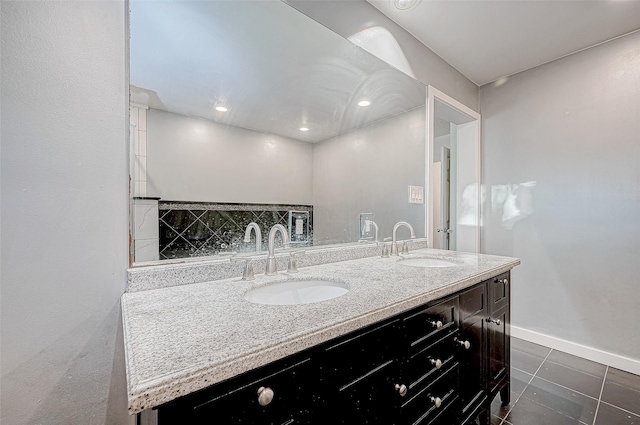 bathroom with tile patterned floors and vanity