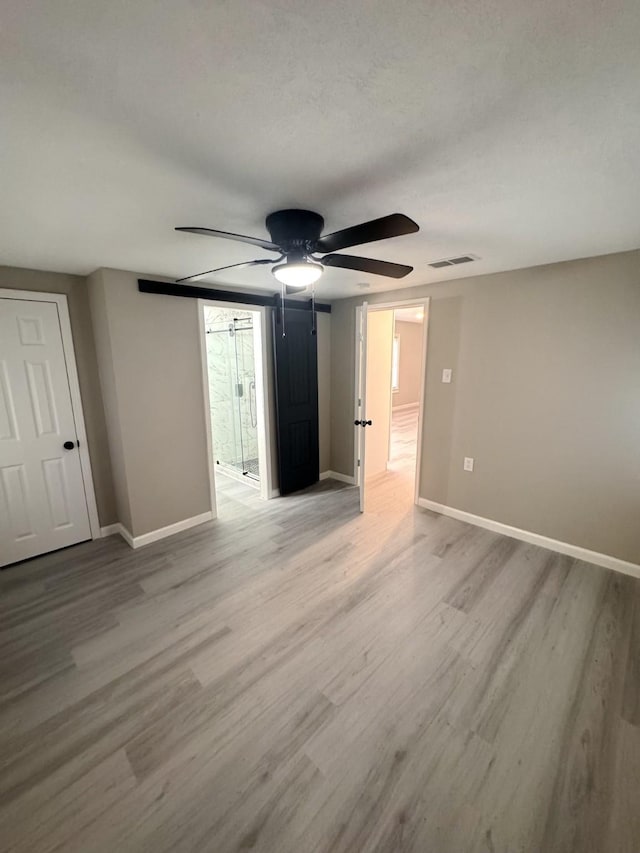 unfurnished room with light hardwood / wood-style floors and ceiling fan