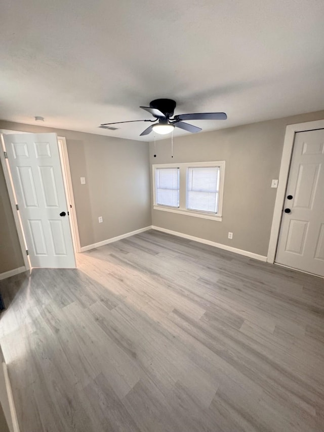 unfurnished room featuring ceiling fan and light hardwood / wood-style floors