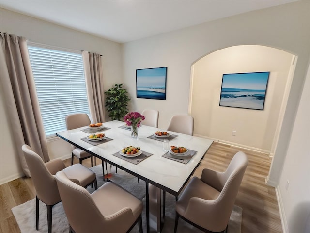 dining space featuring hardwood / wood-style flooring