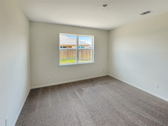 unfurnished room with carpet flooring