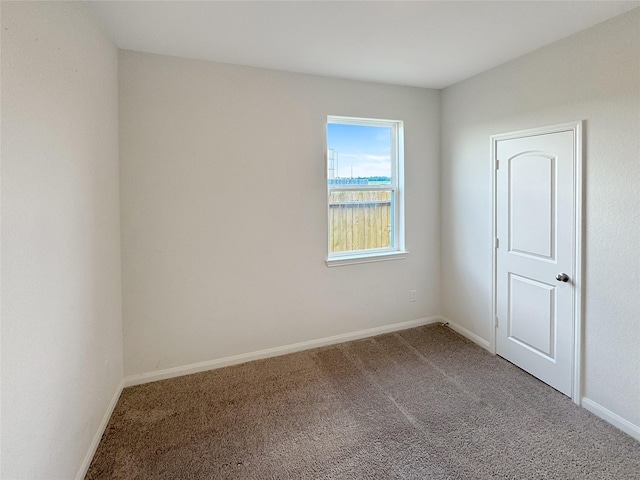 empty room featuring carpet flooring