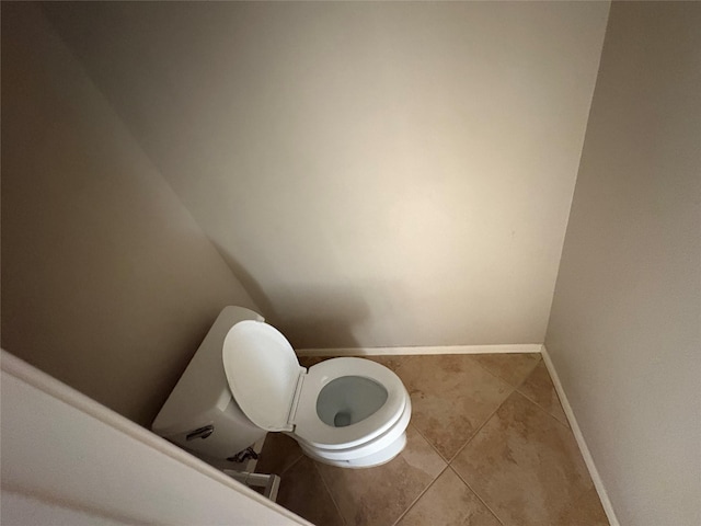 bathroom featuring tile patterned flooring and toilet