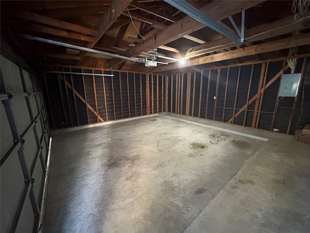 garage featuring a garage door opener and electric panel