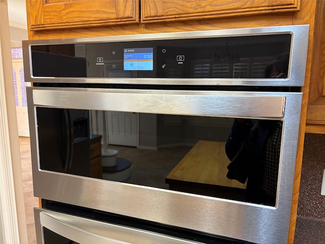 interior details featuring stainless steel oven