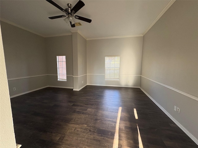 empty room featuring ornamental molding, ceiling fan, and dark wood-type flooring