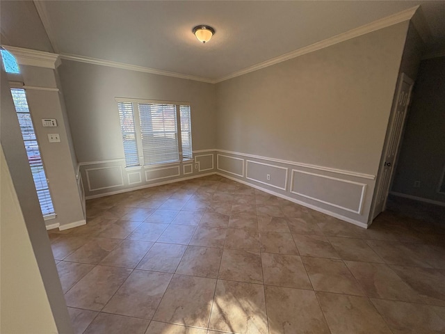 unfurnished room with ornamental molding and light tile patterned flooring