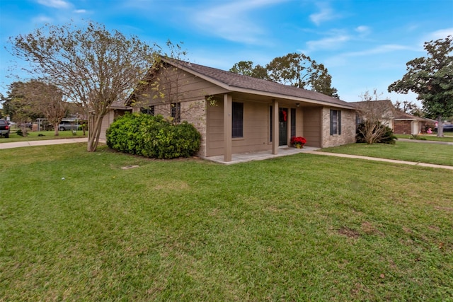 ranch-style home with a front lawn