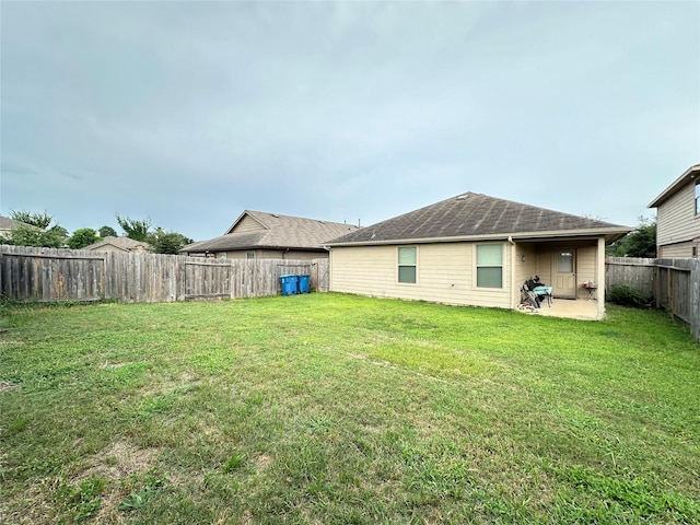 exterior space with a lawn and a patio area